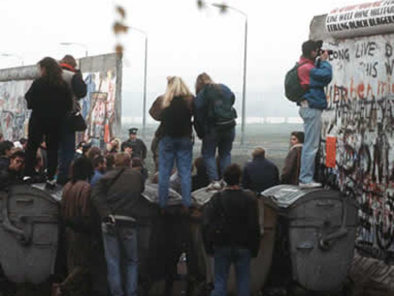 Berlin wall coming down image